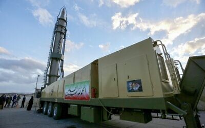An Iranian long-range Ghadr missile with "Death to Israel" written in Hebrew down the side is displayed at a defense exhibition in city of Isfahan, central Iran, on February 8, 2023. (Morteza Salehi/Tasnim News/AFP)