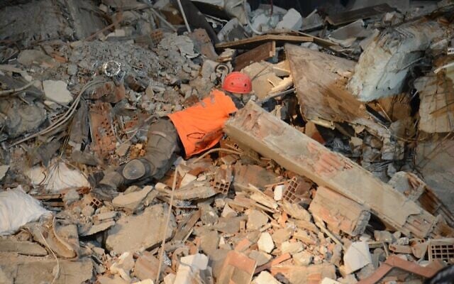 A rescuer searches for victims and survivors through the rubble of collapsed buildings in Adiyaman, on February 8, 2023, two days after a 7.8-magnitude earthquake struck southeast Turkey. (Ilyas Akengin/AFP) A rescuer searches for victims and survivors through the rubble of collapsed buildings in Adiyaman, on February 8, 2023, two days after a 7.8-magnitude earthquake struck southeast Turkey. (Ilyas Akengin/AFP)