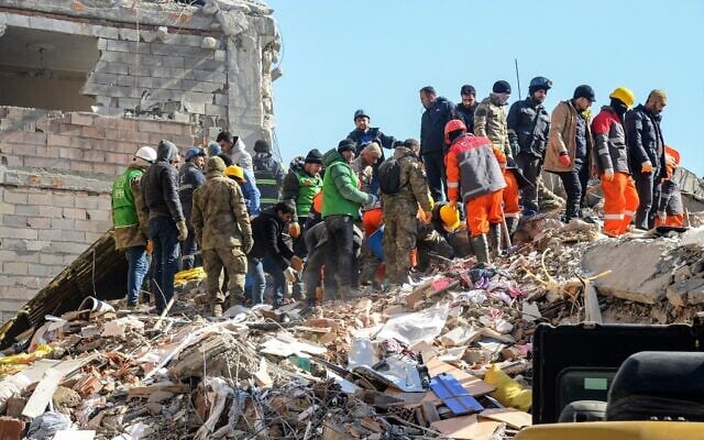 Illustrative: Rescuers carry out search operations among the rubble of a collapsed building in Adiyaman, Turkey on February 9, 2023, three days after a 7,8-magnitude earthquake struck southeast Turkey. (Ilyas AKENGIN / AFP) Illustrative: Rescuers carry out search operations among the rubble of a collapsed building in Adiyaman, Turkey on February 9, 2023, three days after a 7,8-magnitude earthquake struck southeast Turkey. (Ilyas AKENGIN / AFP)