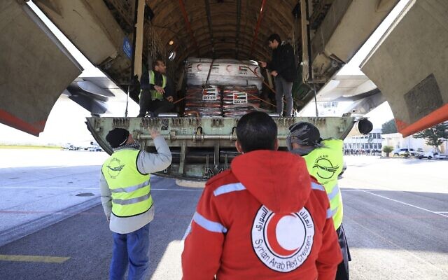 Workers unload aid from the United Arab Emirates at the Bassel Assad international airport in Syria's Mediterranean port city of Latakia on February 11, 2023. (Karim Sahib/AFP) Workers unload aid from the United Arab Emirates at the Bassel Assad international airport in Syria's Mediterranean port city of Latakia on February 11, 2023. (Karim Sahib/AFP)