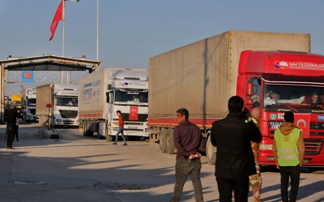 Trucks part of an earthquake aid convoy cross from Turkey into rebel-held north Syria through the Bab al-Salama crossing on February 14, 2023, after it reopened for UN relief. (Bakr Alkasem/AFP) Trucks part of an earthquake aid convoy cross from Turkey into rebel-held north Syria through the Bab al-Salama crossing on February 14, 2023, after it reopened for UN relief. (Bakr Alkasem/AFP)