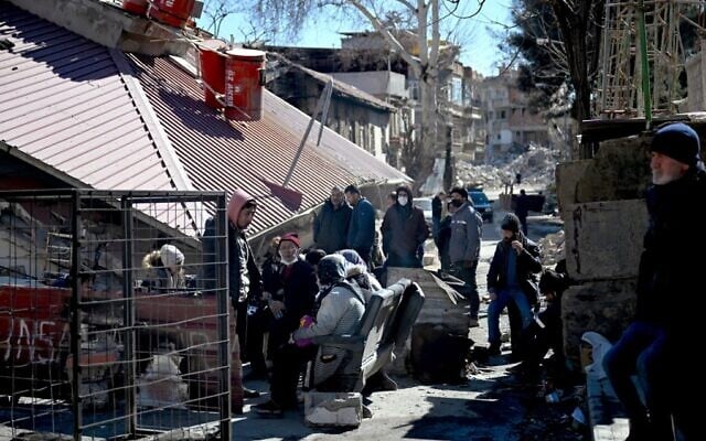 Relatives of victims gather in front of the rubble of a collapsed building, after the 7.8-magnitude earthquake which struck parts of Turkey and Syria, in Kahramanmaras, on February 16, 2023. (Ozan Kose/AFP) Relatives of victims gather in front of the rubble of a collapsed building, after the 7.8-magnitude earthquake which struck parts of Turkey and Syria, in Kahramanmaras, on February 16, 2023. (Ozan Kose/AFP)