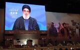 Hezbollah supporters attend a televised speech by the Lebanese terror group's leader Hassan Nasrallah in Beirut's southern suburbs, on February 16, 2023. (Anwar Amro/AFP)
