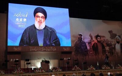 Hezbollah supporters attend a televised speech by the Lebanese terror group's leader Hassan Nasrallah in Beirut's southern suburbs, on February 16, 2023. (Anwar Amro/AFP)