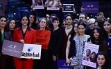 Berlinale Executive Director Mariette Rissenbeek, US actress and Berlinale Jury President Kristen Stewart, Iranian-French actress and jury member Golshifteh Farahani, and others hold  placards reading "Woman Life Freedom" during a protest in solidarity with protesters in Iran, on the red carpet at the Berlinale on February 18, 2023, in Berlin. (John MacDougall/AFP)