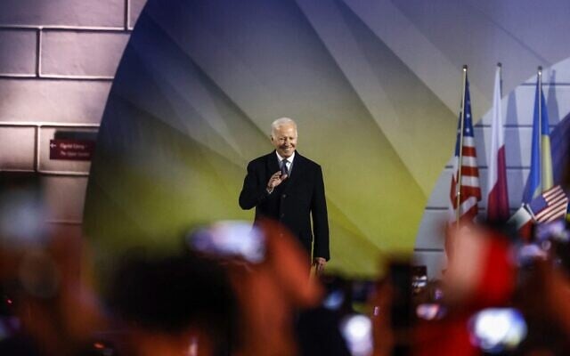 US President Joe Biden arrives on stage before delivering a speech at the Royal Warsaw Castle Gardens in Warsaw on February 21, 2023. (Wojtek Radwanski/AFP) US President Joe Biden arrives on stage before delivering a speech at the Royal Warsaw Castle Gardens in Warsaw on February 21, 2023. (Wojtek Radwanski/AFP)