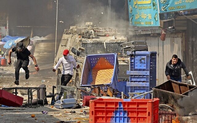 Palestinians clash with Israeli security forces during a raid in Nablus, on February 22, 2023. (Zain Jaafar / AFP)