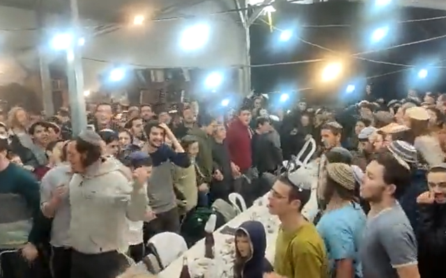 Over 1,500 people participate in a Tu Bishvat seder at Homesh, an illegal outpost in the northern West Bank, February 5, 2023. (Twitter video screenshot: Used in accordance with Clause 27a of the Copyright Law) Over 1,500 people participate in a Tu Bishvat seder at Homesh, an illegal outpost in the northern West Bank, February 5, 2023. (Twitter video screenshot: Used in accordance with Clause 27a of the Copyright Law)