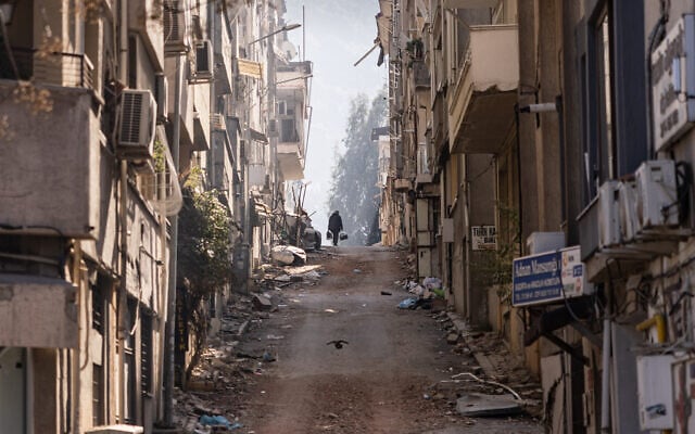 A man walks amid damaged buildings in an area heavily affected by the earthquake in Antakya on February 18, 2023. (Sameer Al-Doumy/AFP) A man walks amid damaged buildings in an area heavily affected by the earthquake in Antakya on February 18, 2023. (Sameer Al-Doumy/AFP)