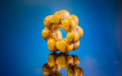 A 1,600-year-old gold bead found in the City of David in Jerusalem, February 2023. (Koby Harati/City of David)
