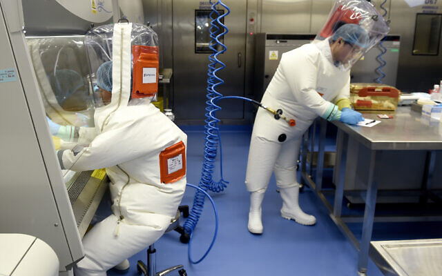 In this photo taken Thursday, February 23, 2017, researchers work in a lab of the Wuhan Institute of Virology in Wuhan in central China's Hubei province. (Chinatopix/AP) In this photo taken Thursday, February 23, 2017, researchers work in a lab of the Wuhan Institute of Virology in Wuhan in central China's Hubei province. (Chinatopix/AP)