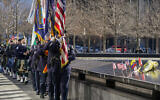 An honor guard, followed by bagpipers, pay their respects to victims of the 1993 bombing World Trade Center during a ceremony marking the 28th anniversary of the attack, in New York, February 26, 2021. (Mary Altaffer/AP)