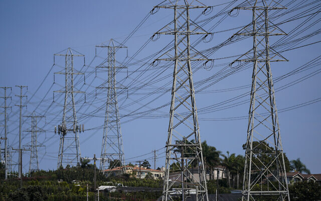 Illustrative: Power transmission towers stand near homes in Redondo Beach, California, September 7, 2022. (AP Photo/ Jae C. Hong) Illustrative: Power transmission towers stand near homes in Redondo Beach, California, September 7, 2022. (AP Photo/ Jae C. Hong)