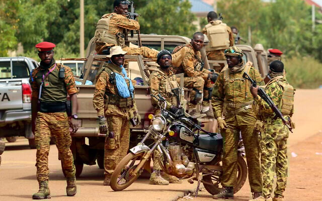 Illustrative: Soldiers loyal to Burkina Faso's latest coup leader Capt. Ibrahim Traore gather outside the National Assembly as Traore was appointed Burkina Faso's transitional president in Ouagadougou, Burkina Faso, Friday, October 14, 2022. (AP Photo/Kilaye Bationo) Illustrative: Soldiers loyal to Burkina Faso's latest coup leader Capt. Ibrahim Traore gather outside the National Assembly as Traore was appointed Burkina Faso's transitional president in Ouagadougou, Burkina Faso, Friday, October 14, 2022. (AP Photo/Kilaye Bationo)