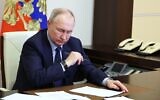 Russian President Vladimir Putin attends a cabinet meeting via videoconference at the Novo-Ogaryovo state residence, outside Moscow, Russia, Wednesday, February 1, 2023. (Mikhail Klimentyev, Sputnik, Kremlin Pool Photo via AP)