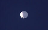 A high altitude balloon floats over Billings, Mont., on Wednesday, February 1, 2023. The US is tracking a suspected Chinese surveillance balloon that has been spotted over US airspace for a couple days, but the Pentagon decided not to shoot it down due to risks of harm for people on the ground, officials said Thursday, February 2, 2023. The Pentagon would not confirm that the balloon in the photo was the surveillance balloon. (Larry Mayer/The Billings Gazette via AP)