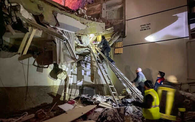 Rescue teams try to reach trapped residents inside collapsed buildings in Adana, Turkey, Feb. 6, 2023 (IHA agency via AP) Rescue teams try to reach trapped residents inside collapsed buildings in Adana, Turkey, Feb. 6, 2023 (IHA agency via AP)