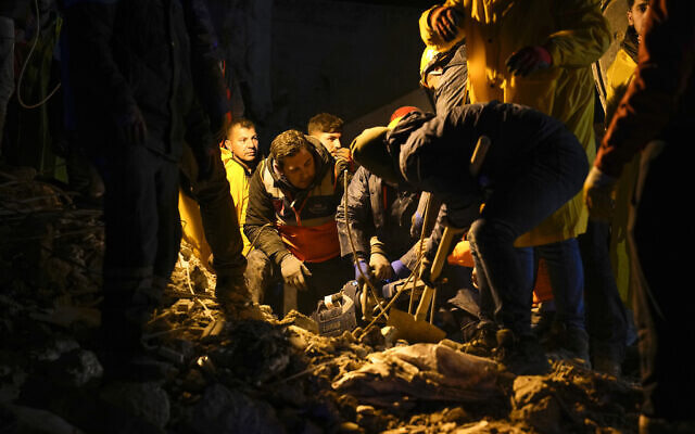 Emergency teams search in the rubble for people in a destroyed building in Adana, Turkey, February 6, 2023. (AP Photo/Khalil Hamra) Emergency teams search in the rubble for people in a destroyed building in Adana, Turkey, February 6, 2023. (AP Photo/Khalil Hamra)