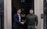 Britain's Prime Minister Rishi Sunak, left, welcomes Ukraine's President Volodymyr Zelensky at Downing Street in London, February 8, 2023. (AP Photo/Alberto Pezzali)