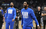 Dallas Mavericks guard Kyrie Irving warms up prior to an NBA basketball game against the Los Angeles Clippers, in Los Angeles, February 8, 2023. (Mark J. Terrill/AP)