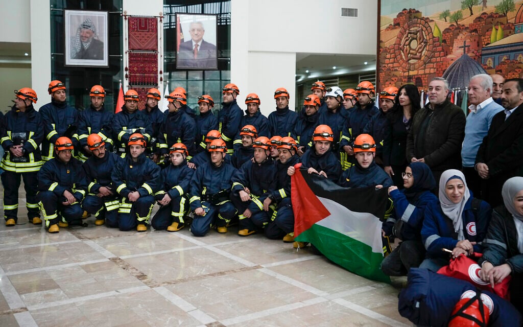 A Palestinian civil defense team including members of the Palestinian Authority's Ministry of Health and the Palestinian Red Crescent, pose for a group photo before they travel to Syria and Turkey, in the West Bank city of Ramallah, February 9, 2023. (AP/Majdi Mohammed) A Palestinian civil defense team including members of the Palestinian Authority's Ministry of Health and the Palestinian Red Crescent, pose for a group photo before they travel to Syria and Turkey, in the West Bank city of Ramallah, February 9, 2023. (AP/Majdi Mohammed)