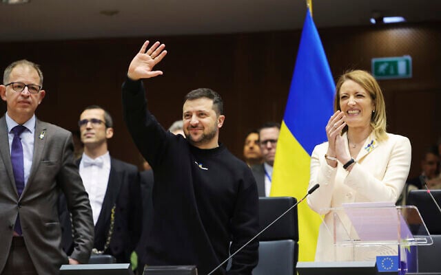 Ukraine's President Volodymyr Zelensky, center, gestures as European Parliament's President Roberta Metsola, right, applauds during an EU summit at the European Parliament in Brussels, Belgium, February 9, 2023. (AP Photo/Olivier Matthys) Ukraine's President Volodymyr Zelensky, center, gestures as European Parliament's President Roberta Metsola, right, applauds during an EU summit at the European Parliament in Brussels, Belgium, February 9, 2023. (AP Photo/Olivier Matthys)