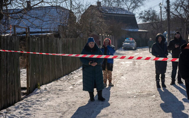 Residents wait behind a police cordon to return to their homes after a rocket attack in Kyiv, Ukraine, February 10, 2023. (AP Photo/Emilio Morenatti) Residents wait behind a police cordon to return to their homes after a rocket attack in Kyiv, Ukraine, February 10, 2023. (AP Photo/Emilio Morenatti)