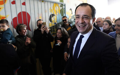 Presidential candidate Nikos Christodoulides smiles as walks with his supporters after casting his vote during the presidential elections in Geroskipou in south west coastal city of Paphos, Cyprus, Feb. 12, 2023 (AP Photo/Petros Karadjias)