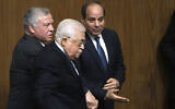Egyptian President Abdel-Fattah el-Sissi, right, greets Palestinian Authority President Mahmoud Abbas, center, and King Abdullah II of Jordan, during a conference at the Arab League headquarters in Cairo, Egypt, February 12, 2023. (AP Photo/Amr Nabil)