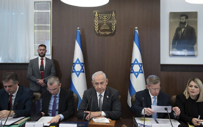 Prime Minister Benjamin Netanyahu, center, chairs the weekly cabinet meeting in Jerusalem, Feb.12, 2023. (AP Photo/Ohad Zwigenberg, Pool)
