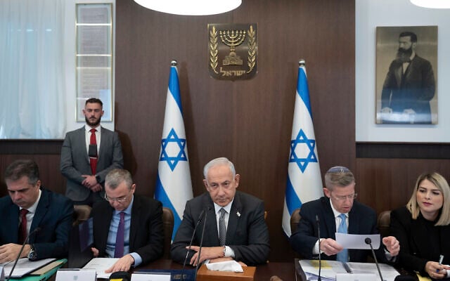 Prime Minister Benjamin Netanyahu, center, chairs the weekly cabinet meeting in Jerusalem, Feb.12, 2023. (AP Photo/Ohad Zwigenberg, Pool) Prime Minister Benjamin Netanyahu, center, chairs the weekly cabinet meeting in Jerusalem, Feb.12, 2023. (AP Photo/Ohad Zwigenberg, Pool)