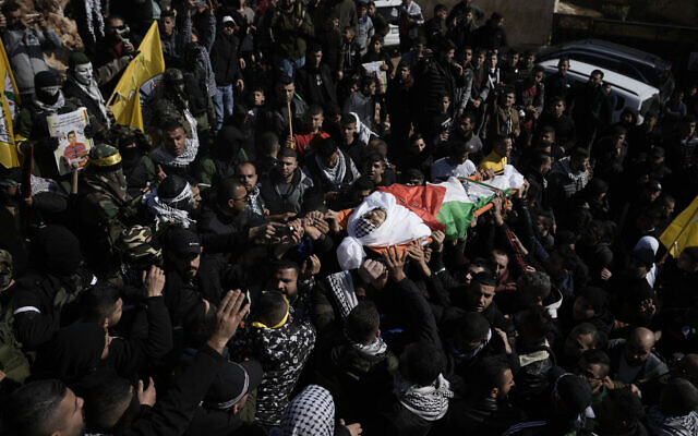 Palestinian mourners carry the body of Methqal Rayan, 27, during his funeral in the village Qarawat Bani Hassan near the West Bank town of Salfit, February 12, 2023. (AP Photo/Majdi Mohammed) Palestinian mourners carry the body of Methqal Rayan, 27, during his funeral in the village Qarawat Bani Hassan near the West Bank town of Salfit, February 12, 2023. (AP Photo/Majdi Mohammed)