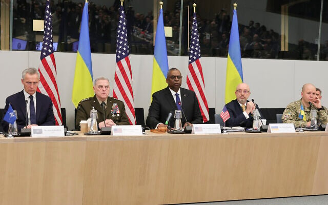 NATO Secretary General Jens Stoltenberg, United States Secretary of Defense Lloyd Austin, Ukraine's Defense Minister Kyrylo Budanov and Ukraine's Lieutenant General Yevhen Moisiuk, from left to right, are seen during the North Atlantic Council round table meeting of NATO defense ministers at NATO headquarters in Brussels, Tuesday, Feb. 14, 2023. (AP Photo/Olivier Matthys)