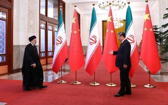 Iranian President Ebrahim Raisi, left, arrives in an official welcoming ceremony by his Chinese counterpart Xi Jinping in Beijing, February 14, 2023. (Iranian Presidency Office via AP) Iranian President Ebrahim Raisi, left, arrives in an official welcoming ceremony by his Chinese counterpart Xi Jinping in Beijing, February 14, 2023. (Iranian Presidency Office via AP)