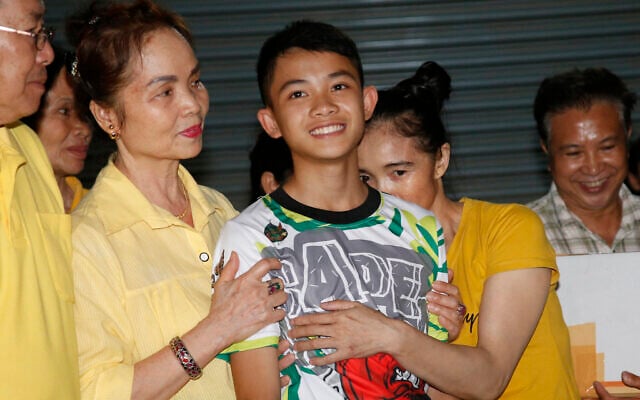 File photo: Relatives of Duangphet 'Dom' Phromthep, one of the boys rescued from the flooded cave in northern Thailand, greet him as he arrives home in the Mae Sai district, Chiang Rai province, northern Thailand, July 18, 2018. Duangphet has died in England where he was attending a sports academy, the Thai foundation sponsoring his studies confirmed Wednesday, Feb. 15, 2023. (AP/Sakchai Lalit) File photo: Relatives of Duangphet 'Dom' Phromthep, one of the boys rescued from the flooded cave in northern Thailand, greet him as he arrives home in the Mae Sai district, Chiang Rai province, northern Thailand, July 18, 2018. Duangphet has died in England where he was attending a sports academy, the Thai foundation sponsoring his studies confirmed Wednesday, Feb. 15, 2023. (AP/Sakchai Lalit)