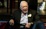 Former US president Jimmy Carter reacts, as his wife Rosalynn Carter speaks during a reception to celebrate their 75th wedding anniversary, July 10, 2021, in Plains, Georgia. (AP Photo/John Bazemore, Pool, File)