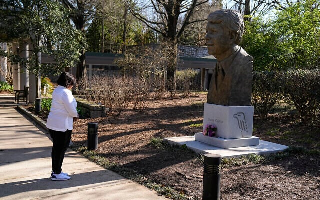 Dawn Thomas of Kankakee Ill., says a short prayer in front of a statue of former President Jimmy Carter at the Jimmy Carter Presidential Library and Museum on Sunday, Feb. 19, 2023, in Atlanta. (AP/John Bazemore) Dawn Thomas of Kankakee Ill., says a short prayer in front of a statue of former President Jimmy Carter at the Jimmy Carter Presidential Library and Museum on Sunday, Feb. 19, 2023, in Atlanta. (AP/John Bazemore)