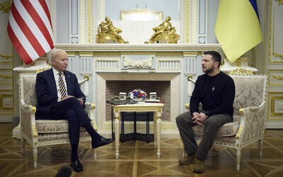 In this photo provided by the Ukrainian Presidential Press Office on Monday, February 20, 2023, Ukrainian President Volodymyr Zelensky, right, and US President Joe Biden speak at Mariinsky Palace during their meeting in Kyiv, Ukraine. (Ukrainian Presidential Press Office via AP)