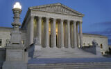 Light illuminates part of the Supreme Court building at dusk on Capitol Hill in Washington, November 16, 2022.  (AP Photo/Patrick Semansky)