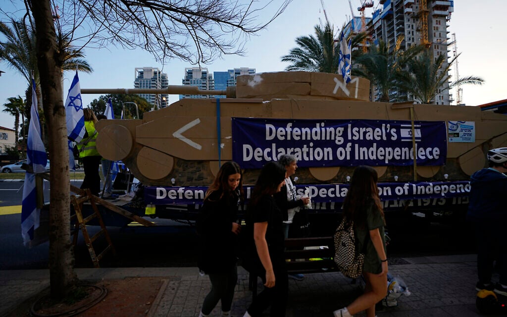 Israelis display a representation of a tank at a protest against government plans to overhaul the judicial system, in Tel Aviv, Feb. 25, 2023. (AP Photo/ Ariel Schalit) Israelis display a representation of a tank at a protest against government plans to overhaul the judicial system, in Tel Aviv, Feb. 25, 2023. (AP Photo/ Ariel Schalit)