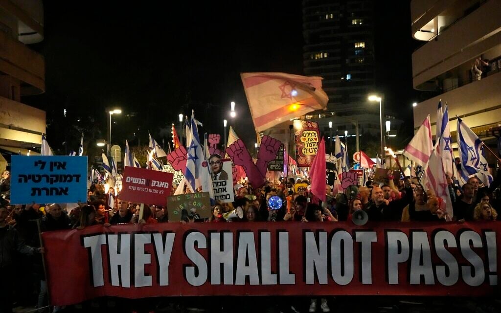 Israelis protest plans by the government to overhaul the judicial system, in Tel Aviv, Feb. 25, 2023. (AP Photo/ Ariel Schalit) Israelis protest plans by the government to overhaul the judicial system, in Tel Aviv, Feb. 25, 2023. (AP Photo/ Ariel Schalit)