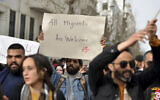 People demonstrate against Tunisian President Kais Saied's comments on migration, February 25, 2023 in Tunis. (AP/Hassene Dridi)