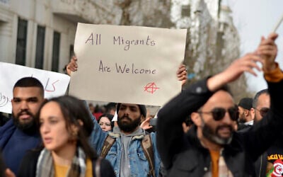 People demonstrate against Tunisian President Kais Saied's comments on migration, February 25, 2023 in Tunis. (AP/Hassene Dridi)