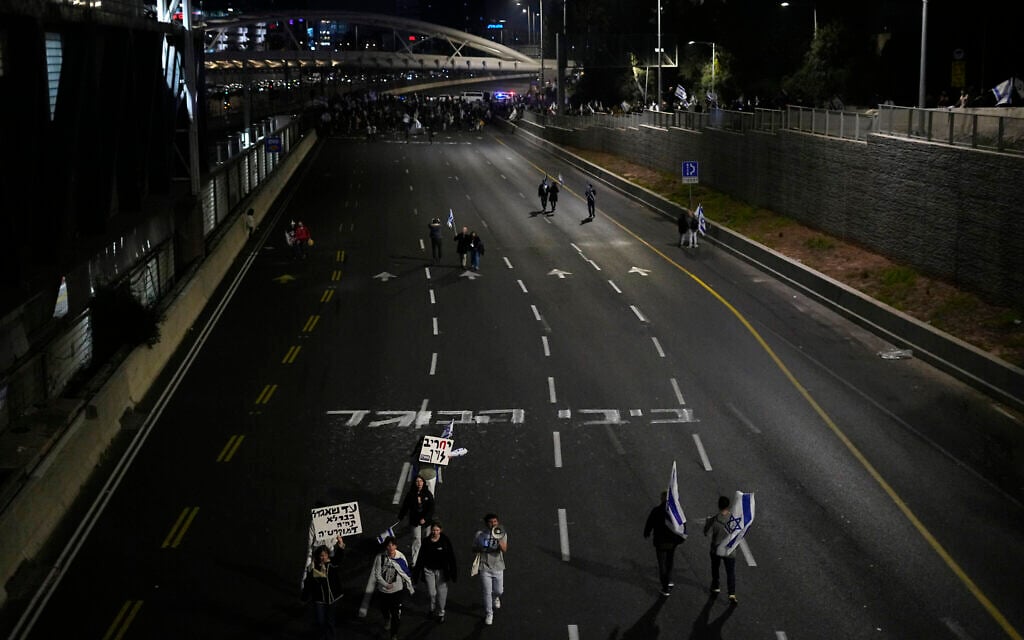 Graffiti reading 'Bibi, traitor' is written across the Ayalon highway during an anti-government protest in Tel Aviv, Feb. 25, 2023. (AP Photo/Ariel Schalit) Graffiti reading 'Bibi, traitor' is written across the Ayalon highway during an anti-government protest in Tel Aviv, Feb. 25, 2023. (AP Photo/Ariel Schalit)