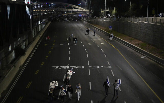 Graffiti reading 'Bibi, traitor' is written across the Ayalon highway during an anti-government protest in Tel Aviv, Feb. 25, 2023. (AP Photo/Ariel Schalit) Graffiti reading 'Bibi, traitor' is written across the Ayalon highway during an anti-government protest in Tel Aviv, Feb. 25, 2023. (AP Photo/Ariel Schalit)