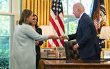 US President Joe Biden hands one of the pens he used for signing the Ukraine Democracy Defense Lend-Lease Act of 2022 to Michigan Representative Elissa Slotkin, May 9, 2022. (AP Photo/Manuel Balce Ceneta, File)