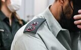 Illustrative: An IDF lieutenant colonel accused of sexual offenses arrives for a court hearing at a military court in Tel Aviv, December 7, 2021. (Avshalom Sassoni/Flash9)