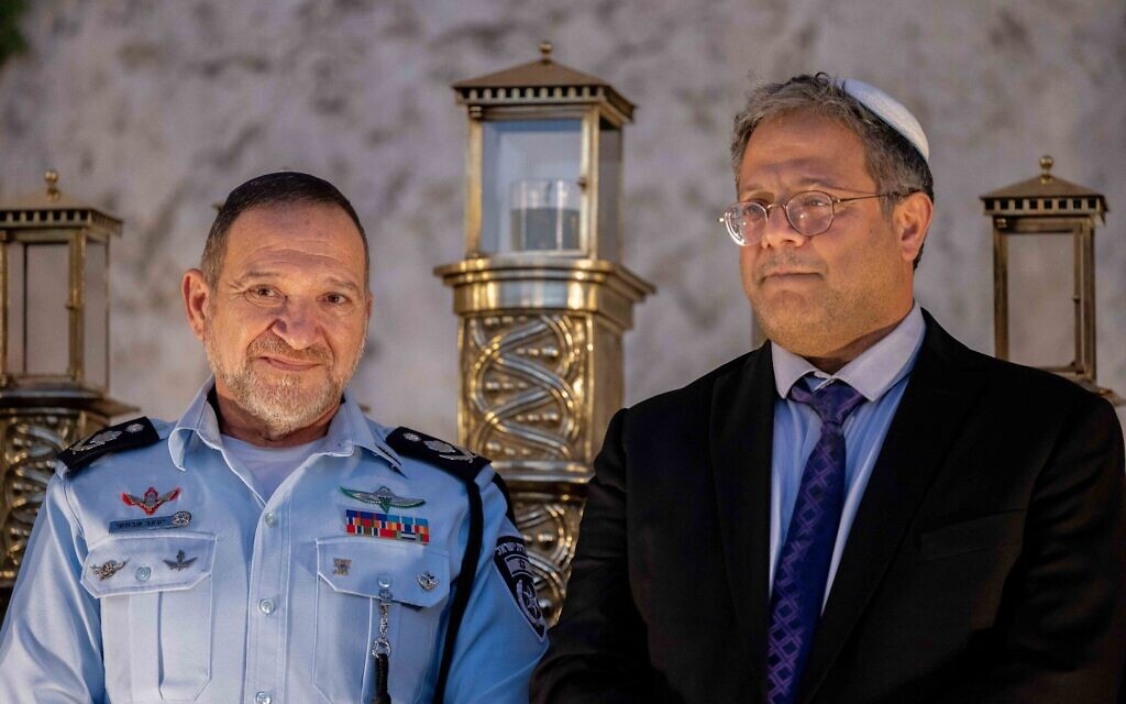 Otzma Yehudit chief Itamar Ben Gvir (R) and Israel Police Commissioner Yaakov Shabtai attend a Hanukkah ceremony at the Western Wall in Jerusalem's Old City, December 19, 2022. (Yonatan Sindel/Flash90) Otzma Yehudit chief Itamar Ben Gvir (R) and Israel Police Commissioner Yaakov Shabtai attend a Hanukkah ceremony at the Western Wall in Jerusalem's Old City, December 19, 2022. (Yonatan Sindel/Flash90)
