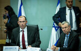 MK Simcha Rothman, head of the Knesset's Constitution, Law and Justice Committee, left, and Justice Minister Yariv Levin attend a committee meeting at the Knesset in Jerusalem on January 11, 2023. (Yonatan Sindel/Flash90)
