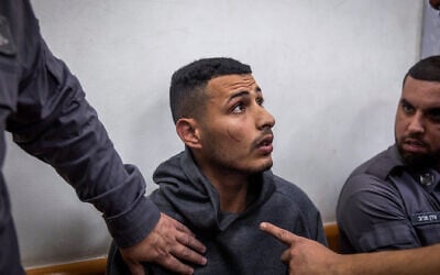 A man, suspected of breaking into an apartment and raping a woman in Gedera, arrives for a court hearing at the Rishon Lezion Magistrate's Court, on February 5, 2023. (Hadas Parush/Flash90) A man, suspected of breaking into an apartment and raping a woman in Gedera, arrives for a court hearing at the Rishon Lezion Magistrate's Court, on February 5, 2023. (Hadas Parush/Flash90)